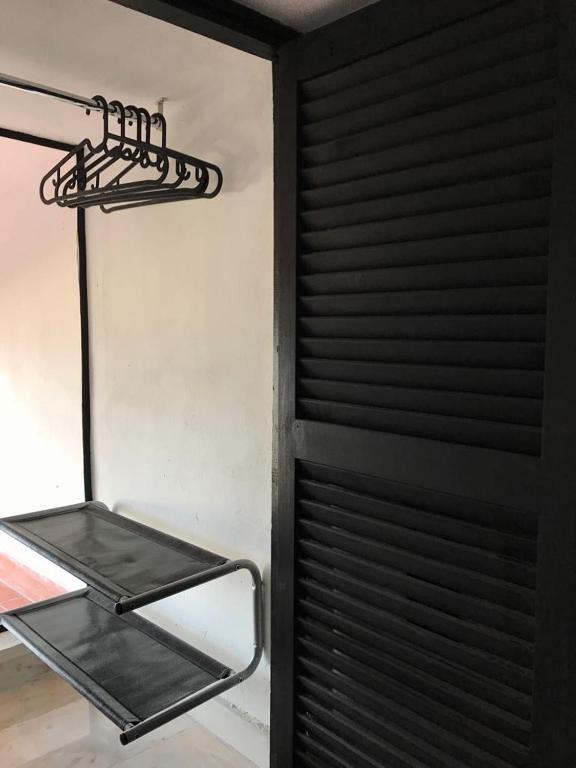 Clothes drying rack in a modern apartment bedroom, perfect for comfortable holiday accommodation in Málaga.