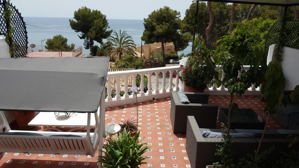 Sea view terrace with garden furniture at Jacuzzi Views Málaga luxury apartment in Spain.