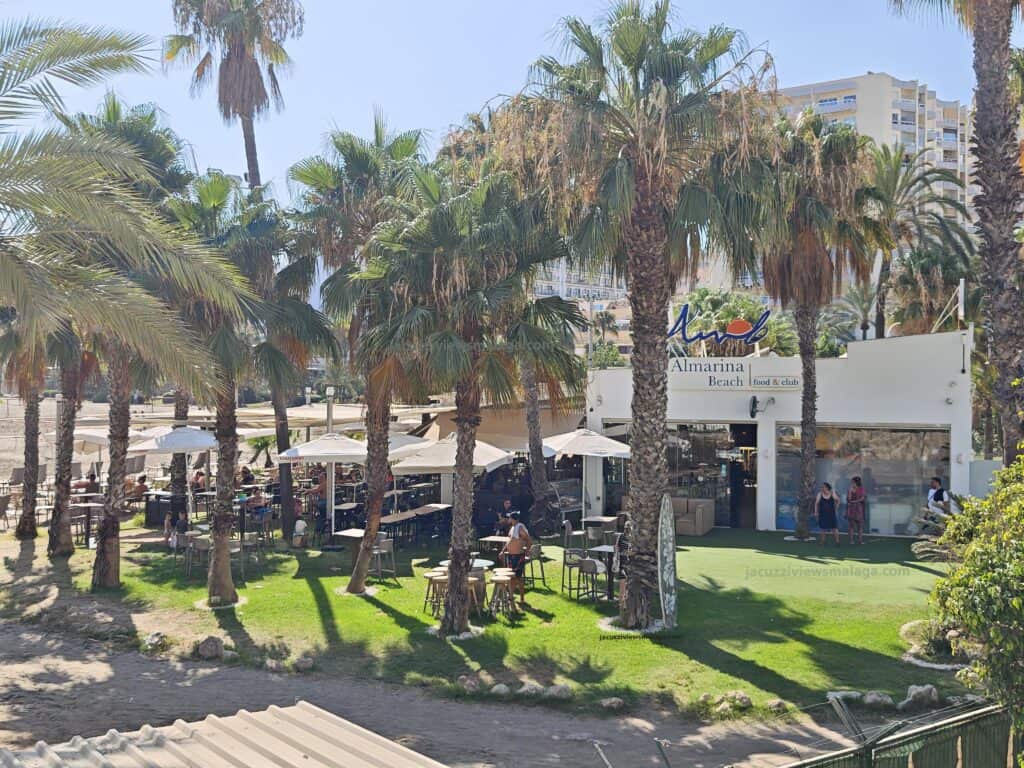 Almarina beach chuiringuito with palm trees