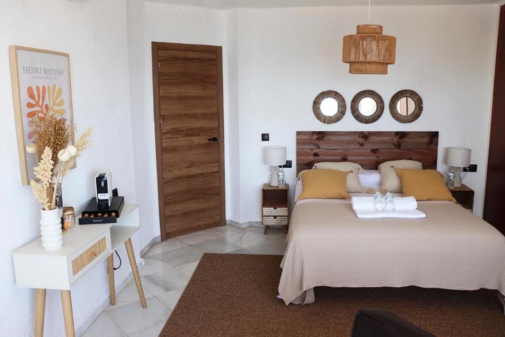 Luxurious bedroom in Malaga villa with stylish decor and cozy amenities.
