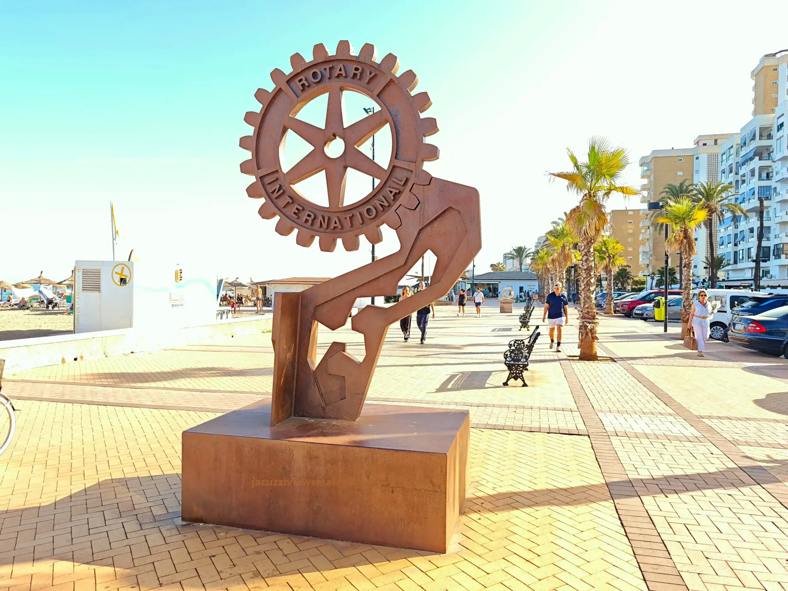 Rotary International Monument on Fuengirola promenade – metal gear sculpture near Malaga beaches and chiringuitos on the Costa del Sol.
